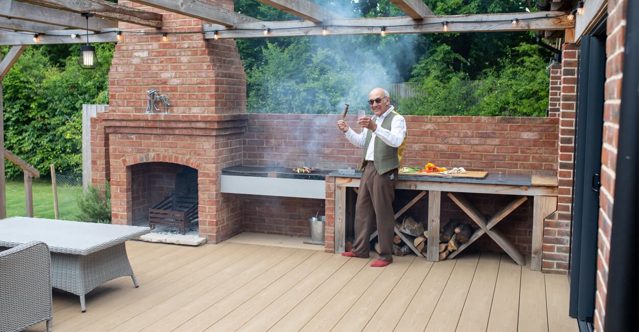 Cedar Wood PVC Decking with an outdoor kitchen and pergola