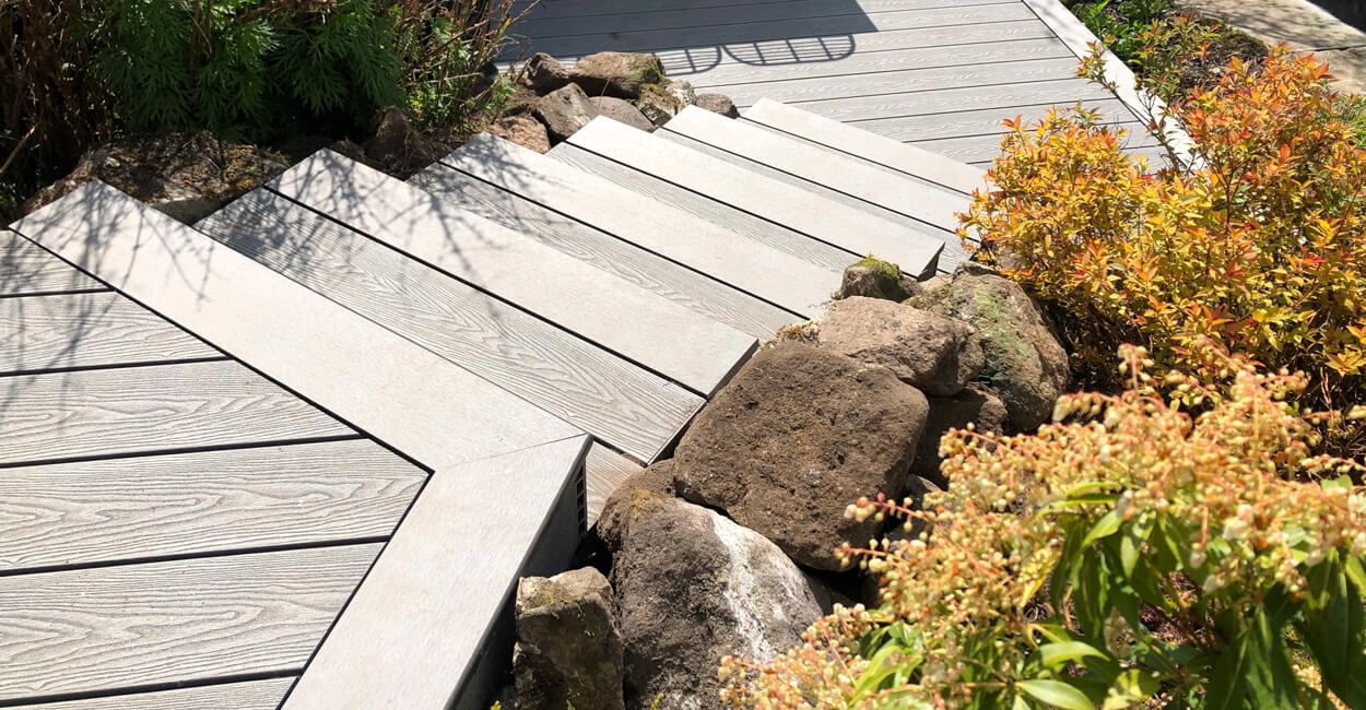 DECKING with Bullnose edging used as a stepped walkway between outdoor spaces