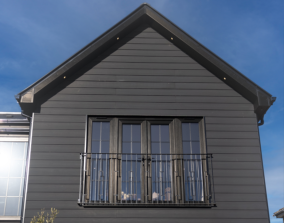 Angled view of the front of the house looking up.