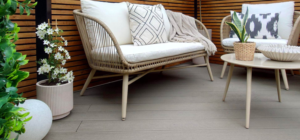 Outdoors space with table and chairs on Cladco composite decking.